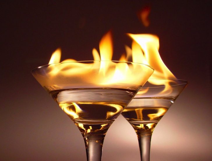 Why does the consumption of alcohol produce a burning sensation